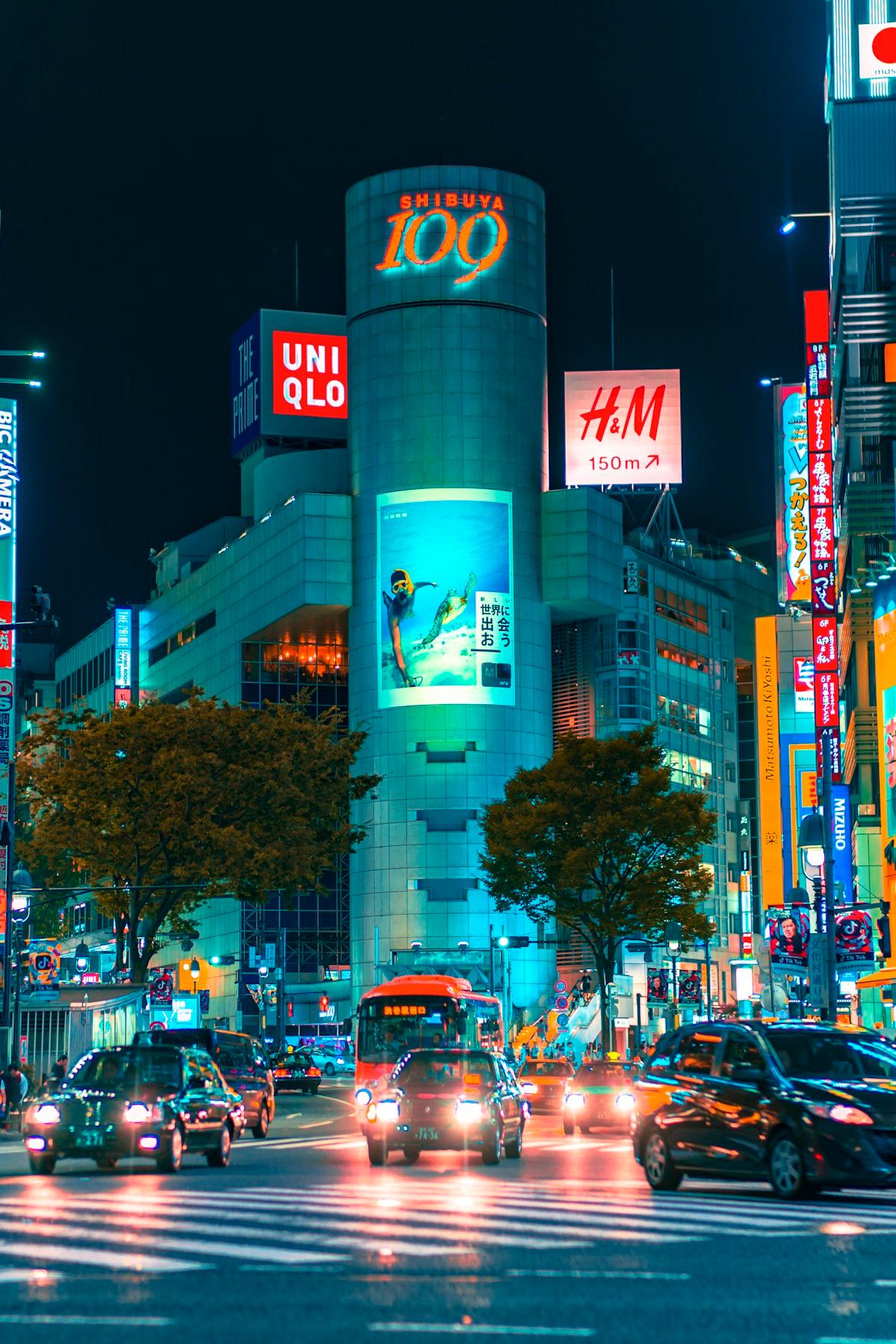 Street scene with neon reflections on wet pavement